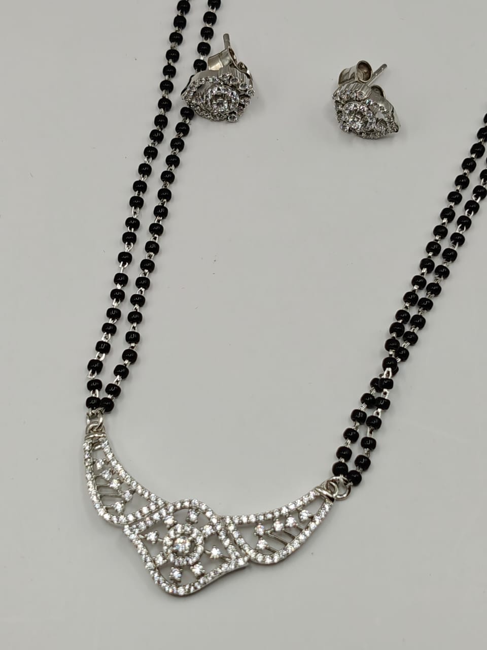 Elegant Diamond-Studded Silver Mangalsutra with Earrings